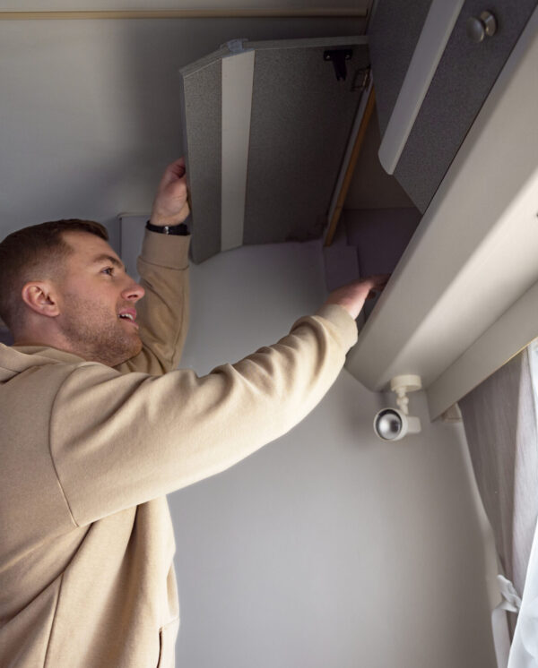 medium-shot-smiley-man-campervan (1)